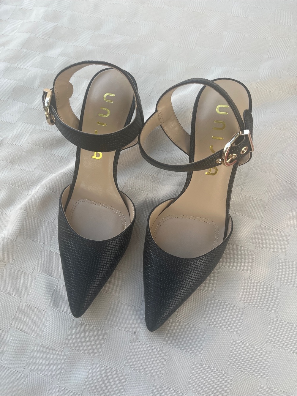 Unisa Black Pointed-Toe Ankle Strap Heels with Gold Buckle